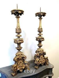 A pair of early 18th century style wood and plaster Italian candelabras
