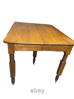 Early 20th Century Pine Wood 5th Leg Dining Table on Casters (36L X 42W x 30H)