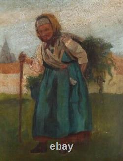 École russe du début du XXe siècle : Femme portant du bois à l'huile