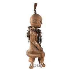 Figure de bois du début du 20ème siècle, Nigeria, représentant un fétiche Fon assis
