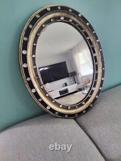 Miroir ovale en bois ébonisé et doré de style géorgien irlandais du début du 19ème siècle